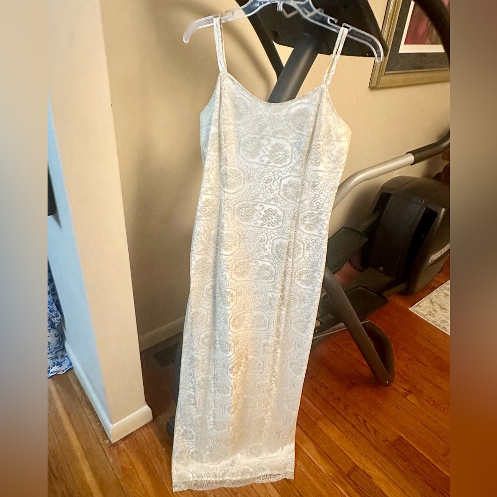 Formal dress, gold shimmer thread. Thin straps. Excellent condition. Size 6.